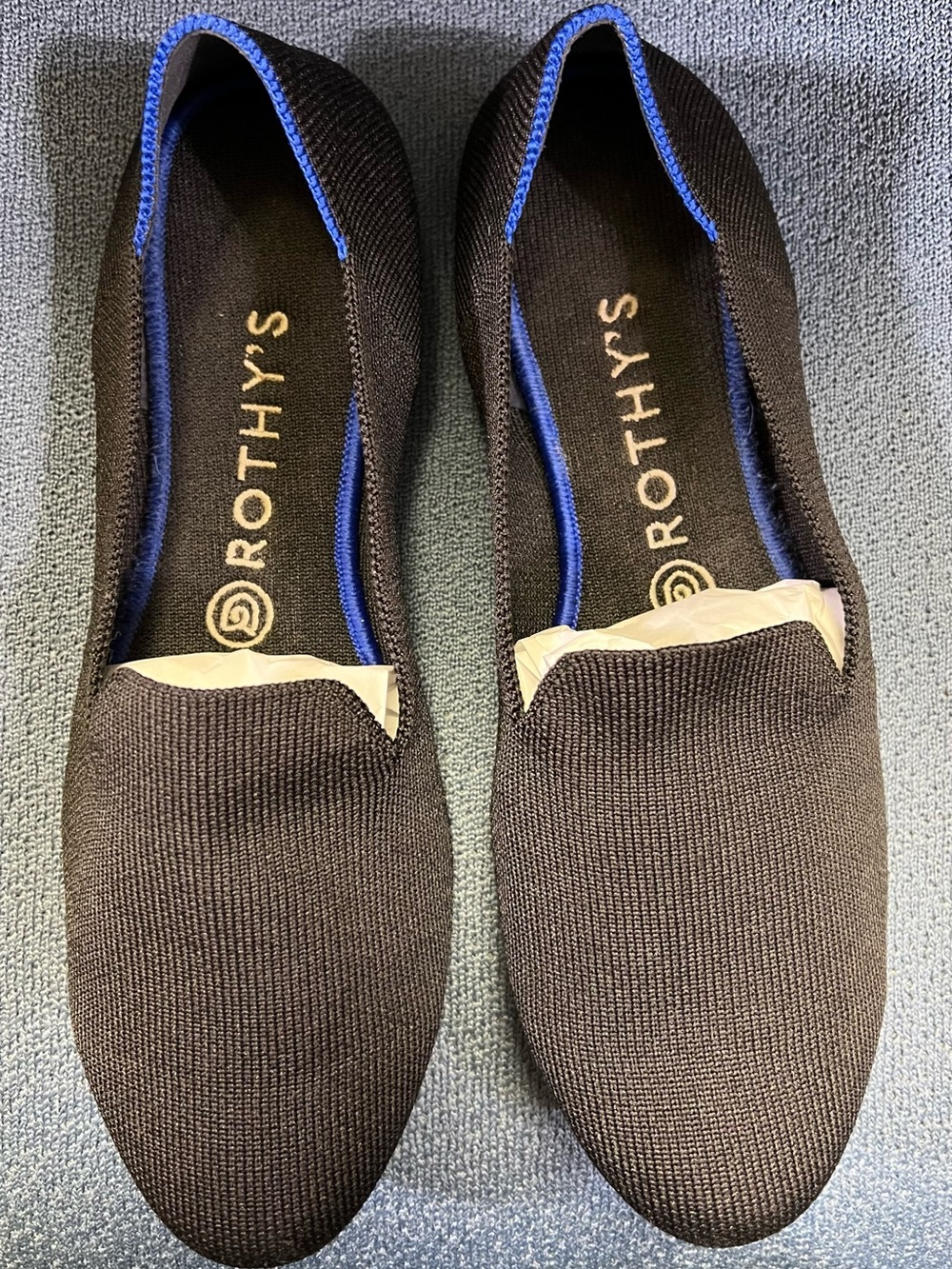 Rothy's Wonen’s Black Slip-On Knit Loafers with Blue Trim